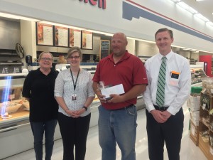 Julie Scheib and Jenny Hornsby with the Perry Chamber, recipient Kenny West and Perry Hy-Vee Store Director Matt May