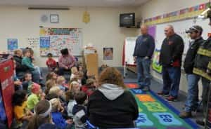 Love, far left, teaching elementary students last year about fire safety