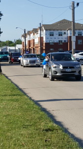 The Perry softball parade, led by head coach Tina Kenney, drives by Pattee Park Sunday inviting fans to attend Tuesday night's Regional Final softball game.  The Jayettes will be looking for their first appearance at the state tournament since 1999.