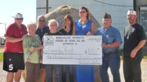 (L-R): VFW Post Commander Don Ihnken, Karen Spring-Pope, Ted Springer, Kay Springer-Moranville, Kim Meyer, Does President Tina Nelson, Jim Andrew and Kenny Arkbuckle