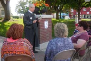 Alan Robinson portraying Judge Gates