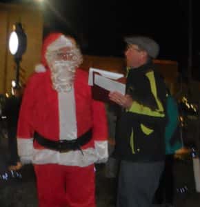 Santa talking with the emcee Don Van Gilder