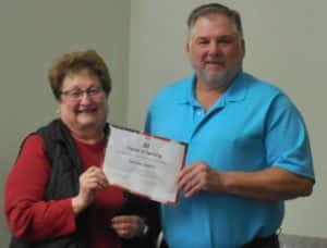 Treasurer Donna Lawson (left) with Supervisor Chair John Muir (right) on being recognized for 30 years as County Treasurer