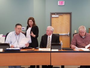 Supervisor Mark Hanson, Auditor Julia Helm, Supervisor Chairperson Kim Chapman, and Supervisor Brad Golightly looking over the canvass information; photo by Joe Cerwinske