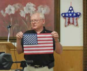 Jefferson Elks member Les Fister conducting a flag ceremony