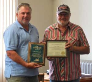 Supervisor Chair John Muir (left) with secondary roads retiree Gary Schmidt (right)