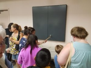 Attendees try the yardstick eclipse experiment 