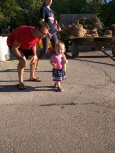 Even the youngest attendees got into corn shucking