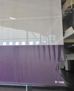 Torn divider curtain in gym