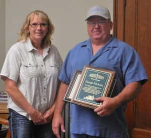 Supervisor Vice-Chair Dawn Rudolph (left) with Retiring Secondary Roads employee George Erickson (right)