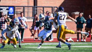ADM graduate Jordan Grove (No. 32) catches the ball and moves up field in last Satuday's 17-10 victory over Central Oklahoma. Photo courtesy of Northwest Missouri State Athletics. 