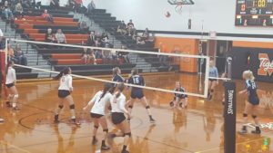 Panorama senior Nicole Rolfes (Blue No. 28) digs up the ball during Tuesday's regional opener versus Madrid. Photo by RVR's Nate Gonner.