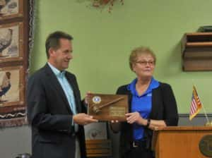 President Vicky Lautner (right) presenting appreciation plaque to Past-President Mike Palmer (left)