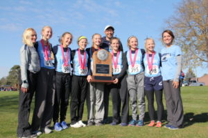 Panorama's Greg Thompson (middle) poses for a picture after the Panther girls cross country team finished second at the Class 1A Iowa State Cross Country Meet October 28 in Fort Dodge. Photo courtesy of Eileen Nordquist/Panorama Cross Country.