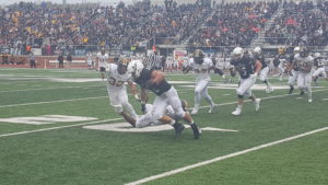 ADM 2013 graduate Jordan Grove (No. 32 black) shakes off a defender during his senior day football game for the Northwest Missouri State University Bearcats. Photo by RVR's Nate Gonner.