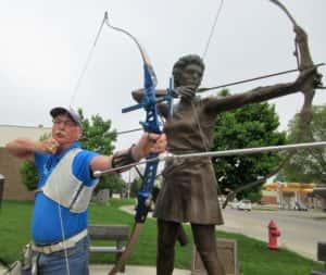 Don Orris poses next to Doreen Wilbur statue. Photo courtesy of Greene Co Historical Society