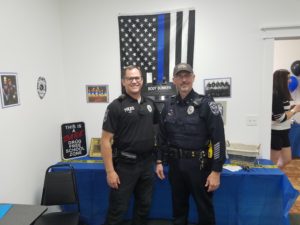 Retiring Perry Police Officer Pat Jans (right) and Chief Eric Vaughn (left)