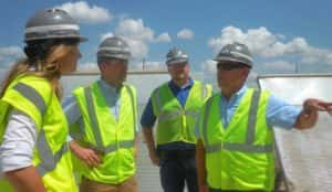 Iowa Deputy Sec. of Ag. Julie Kenney, Iowa Sec. of Ag. Mike Naig listen to Landus Cooperative's Roger Fray talk about grain storage