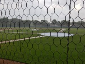 Heavy rain falls at Merchant Park in Carroll, prompting a postponement of Tuesday's RRC Baseball game. Photo by RVR's Nate Gonner.
