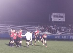 ADM boys soccer players celebrate an overtime win over Perry Tuesday night at Dewey Field. Photo by RVR's Nate Gonner.