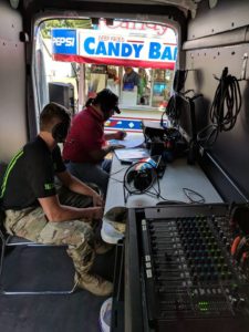 Raccoon Valley Radio's Kevin Waters (right) interviews a representative from the Iowa National Guard in the Big Red Radio at the 2018 Dallas County Fair