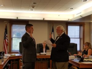 Dan Miller (left) sworn in my Adel Mayor Jim Peters (right)