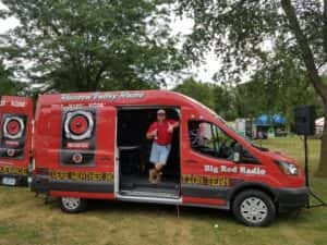 Raccoon Valley Radio's Kevin Waters with the Big Red Radio at the 2017 Dallas County Fair