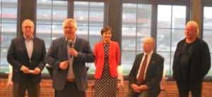 Linc Kroeger (talking) with Pillar Technology as US Rep David Young, Governor Kim Reynolds, US Senator Charles Grassley and Pillar CEO Bob Myers from Froge Kickoff in May