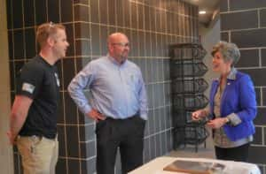 Senator Ernst (right) talking with two reps from Bauer Built