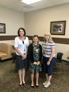 Lupita Chavez (center) with Angela Mortoza (left) and Sally Swenson (right); photo courtesy of Dallas County Hospital