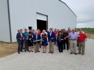 Front Row (L-R): Dallas County Supervisor Mark Hanson, Perry City Administrator Sven Peterson, IEDA Director Debi Durham, Perry Mayor John Andorf, PEDI President Debra Lucht, Lieutenant Governor Adam Gregg, and GDCDA Executive Director Linda Wunsch