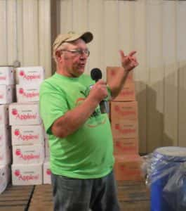 Jerald Deal talking about the cooler that is used to store the apples