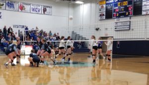 The Panorama Volleyball team celebrates match point against the Van Meter Bulldogs in the Class 2A Region 3 opener Tuesday night. Photo by RVR's Nate Gonner. 