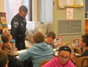 Officer Jans (standing) interacting with P-C 5th graders