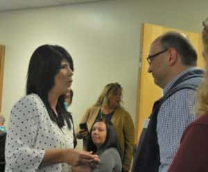 Nicole Steffens (left) pinning Mike Ewalt (right) during veterans pinning ceremony