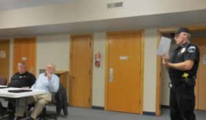 Police Chief Mark Clouse (standing right) presenting to the City Council