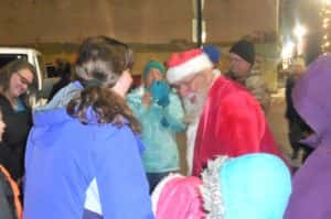 Santa visiting with kids at Welcome Center