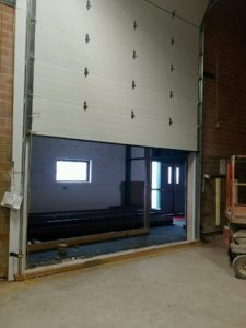 Photo of overhead door being installed. Photo courtesy of Dan Brubaker