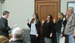 Magistrate David Morain (left) swearing in County Treasurer Katlynn Gannon-Mechaelsen, County Recorder Marcia Tasler, Supervisors Dawn Rudolph and Tom Contner