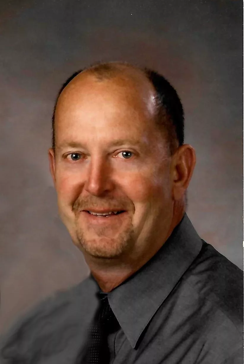 daniel-randy-photo-front-of-folder-1