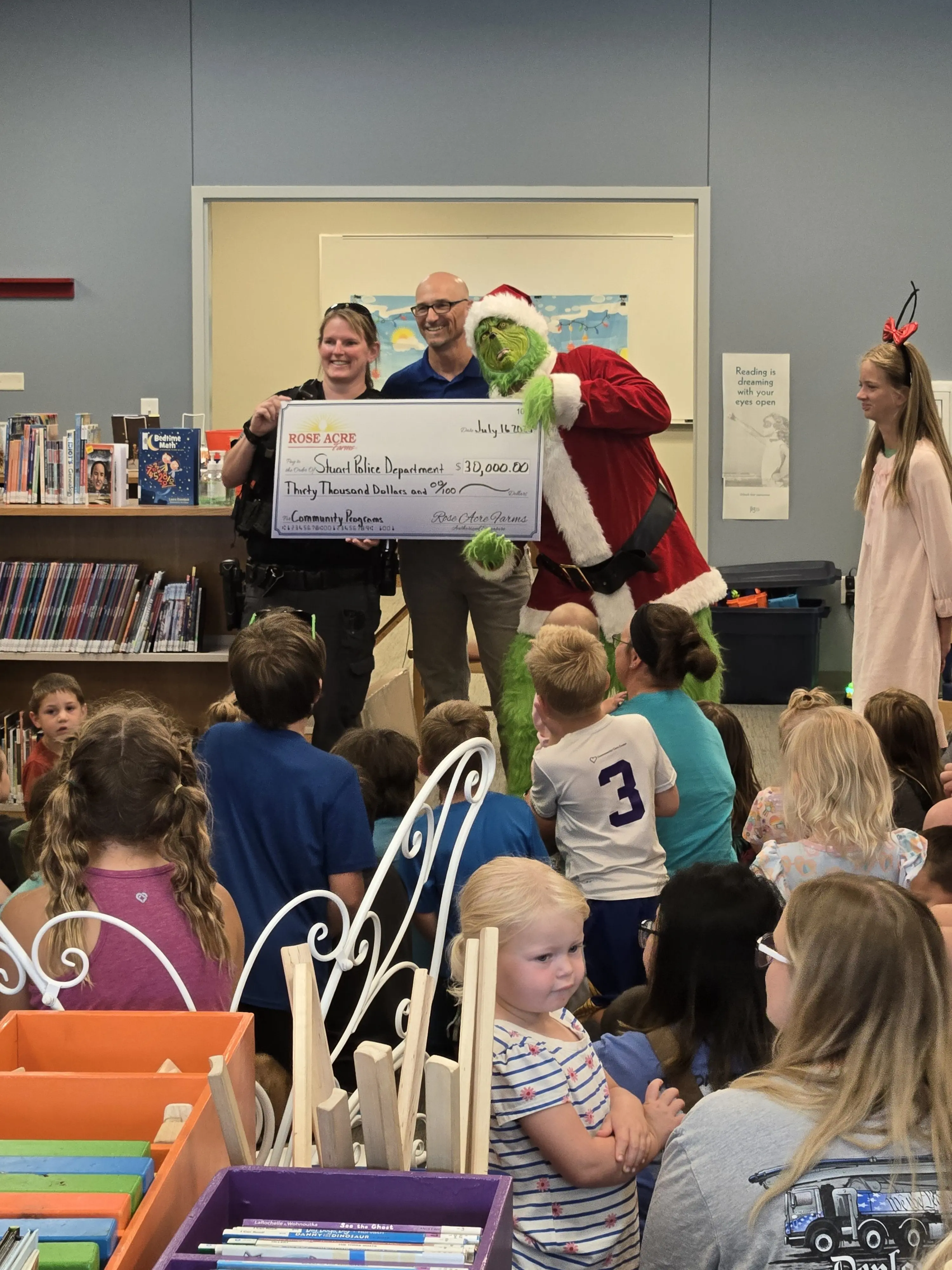 sgt-katie-presented-with-check-by-rose-acre-farms-stuart-manager-andy-kaldenberg