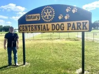 shane-olson-with-dog-park-sign