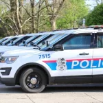 Columbus Ohio May 1^ 2022 A succession of police cars lined up in front of precinct.