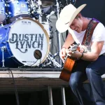 Dustin Lynch performs during the 'Kick The Dust Up' Tour at Vanderbilt Stadium on July 11^ 2015 in Nashville^ Tennessee.