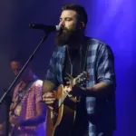 Jordan Davis performs at CMT's RAMJAM on June 3^ 2019 at TopGolf in Nashville^ Tennessee.