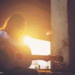 Candid silhouette woman chill play acoustic guitar musician Artists female sad mood activity music at balcony flare lighting sunset background