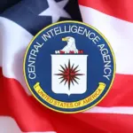 United States of America Central Intelligence Agency coat of arms sticker on folded US flag close up