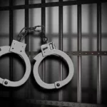 arrest-jail-bars-and-cuffs