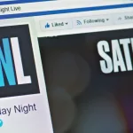 A computer screen shows details of Saturday Night Live page on Facebook web site. Selective focus.