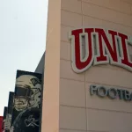 UNLV Football sign on building along with banners of images of team members. University of Nevada Las Vegas home of Rebels.Las Vegas NV: USA: July 1^ 2021